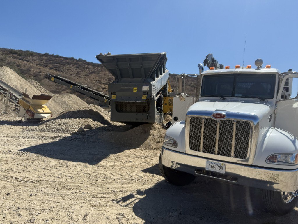 White Peterbilt truck at a fleet and heavy equipment site