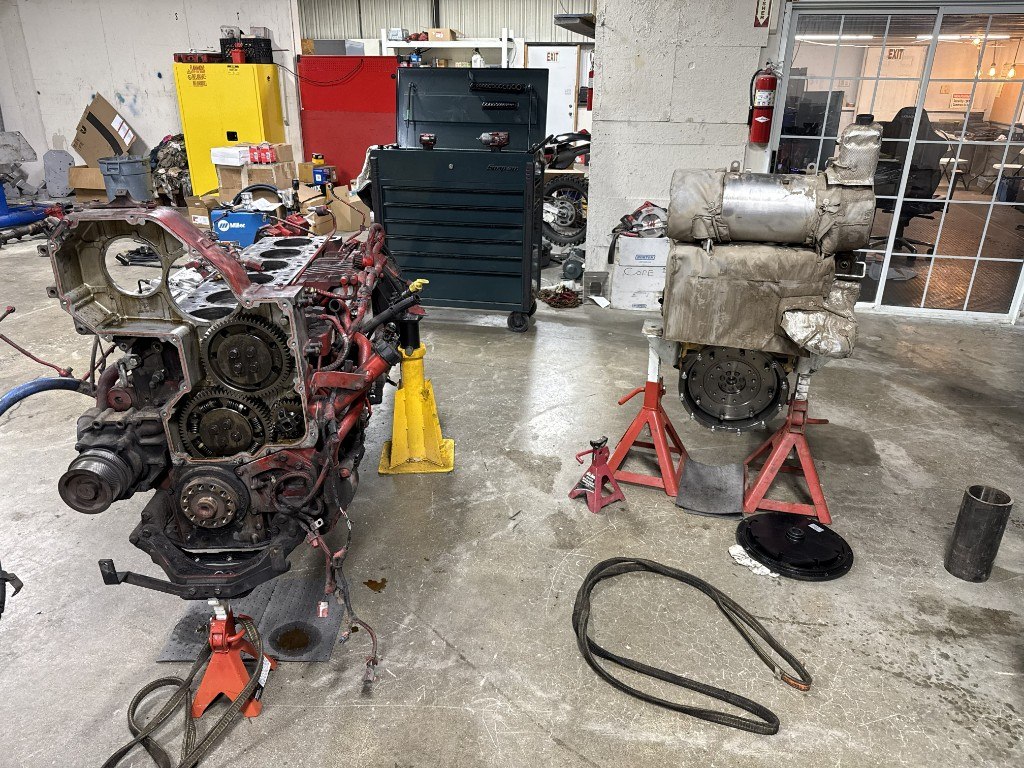 Diesel engines on stands in a heavy-duty repair shop